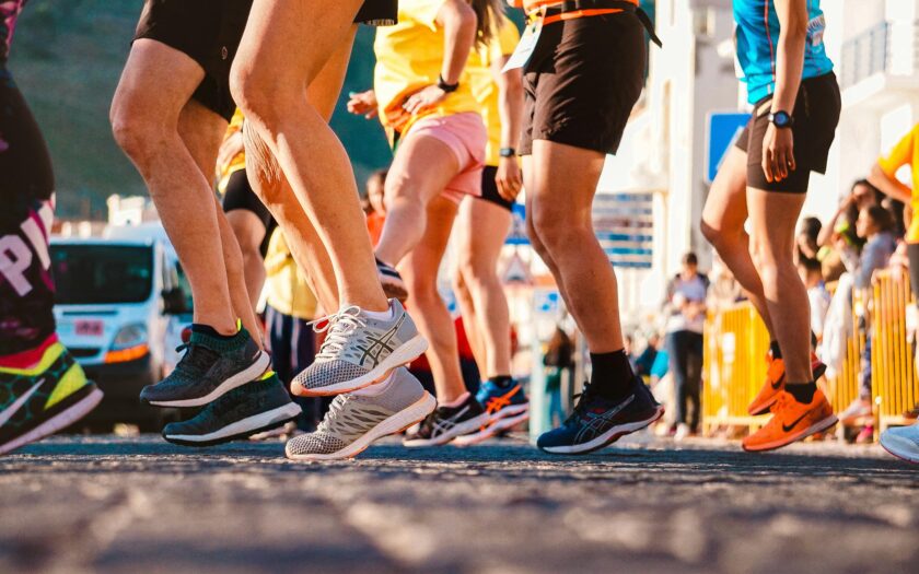 Group of runners participating in a city marathon during daylight.